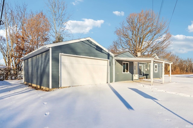 ranch-style house with a garage and a porch