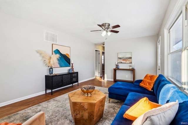 living room featuring ceiling fan and light hardwood / wood-style floors