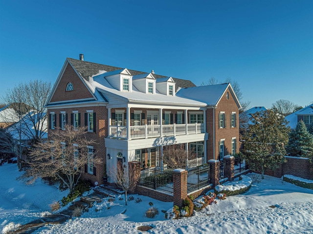 view of front of house with a balcony