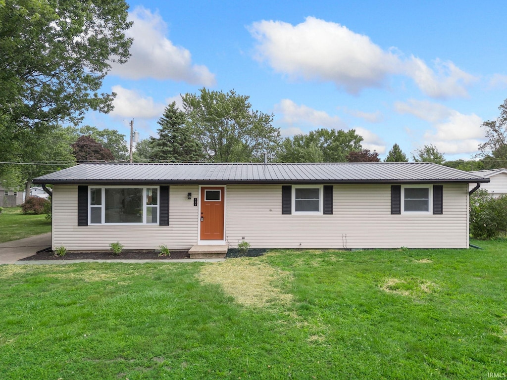 ranch-style house with a front lawn