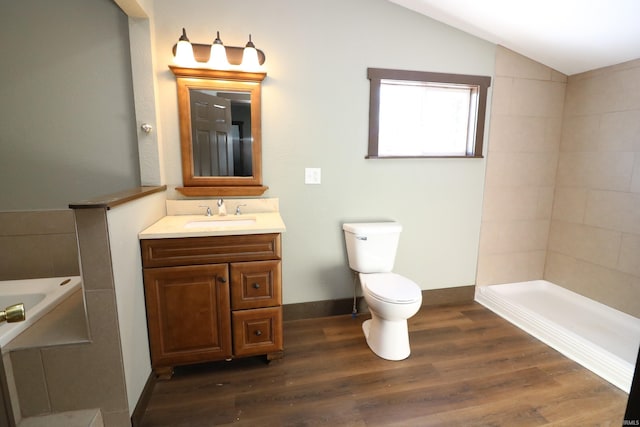 full bathroom featuring lofted ceiling, hardwood / wood-style flooring, vanity, separate shower and tub, and toilet