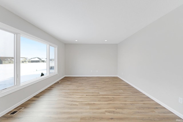 empty room featuring light hardwood / wood-style floors