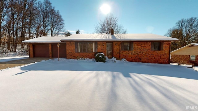 single story home featuring a garage