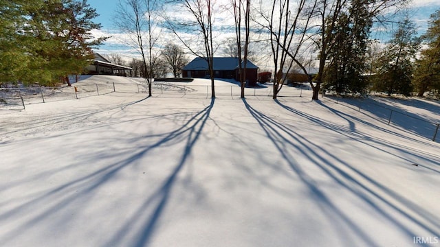 view of yard layered in snow