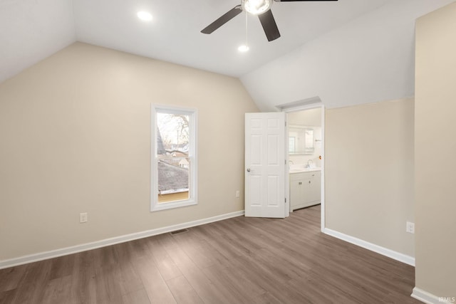 bonus room with vaulted ceiling, sink, ceiling fan, and dark hardwood / wood-style floors