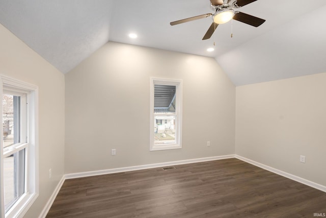 additional living space with lofted ceiling, ceiling fan, and dark hardwood / wood-style flooring