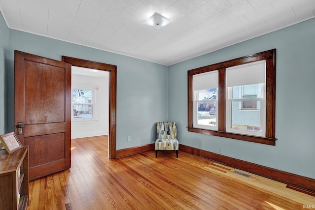 sitting room featuring light hardwood / wood-style floors