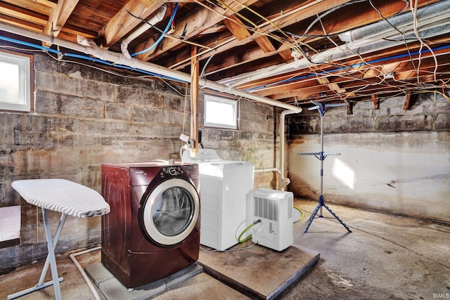 basement featuring washer and dryer and a wealth of natural light