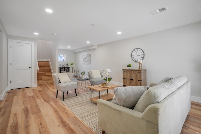 living room with light hardwood / wood-style flooring