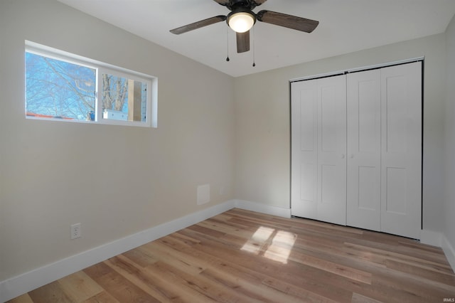 unfurnished bedroom with a closet, ceiling fan, and light hardwood / wood-style floors