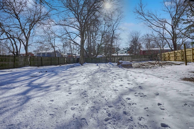 view of yard covered in snow