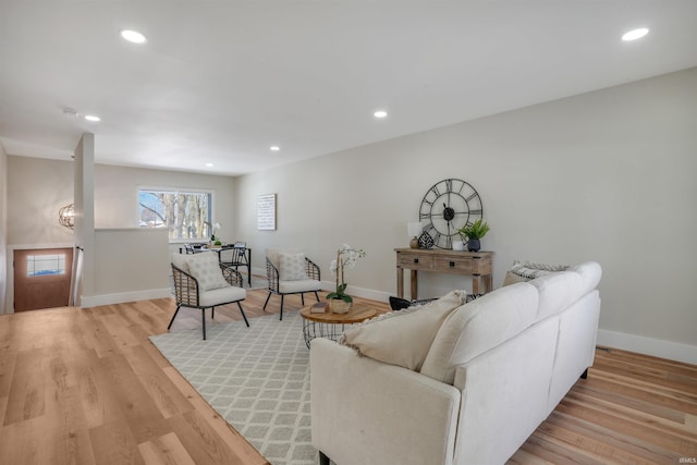 living room with light hardwood / wood-style flooring