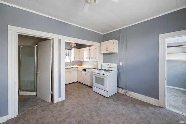 kitchen featuring ornamental molding, white cabinetry, and white range with gas stovetop