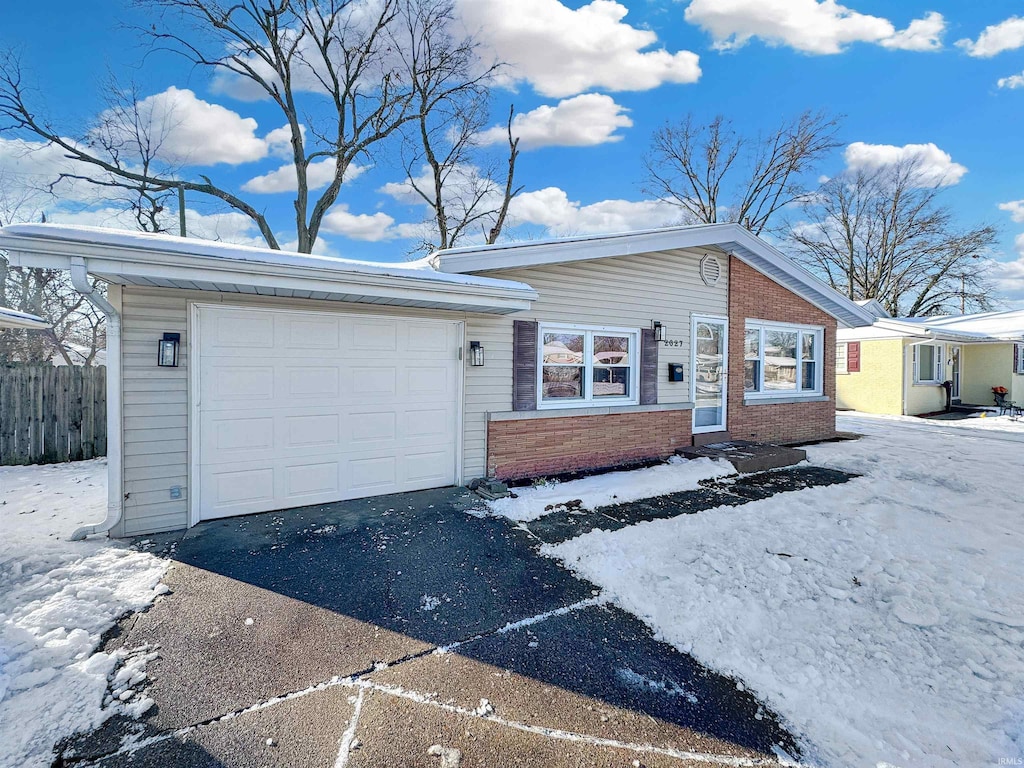 single story home featuring a garage