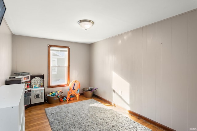 recreation room with light wood-type flooring