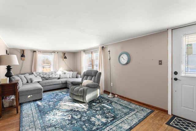 living room featuring light wood-type flooring and plenty of natural light