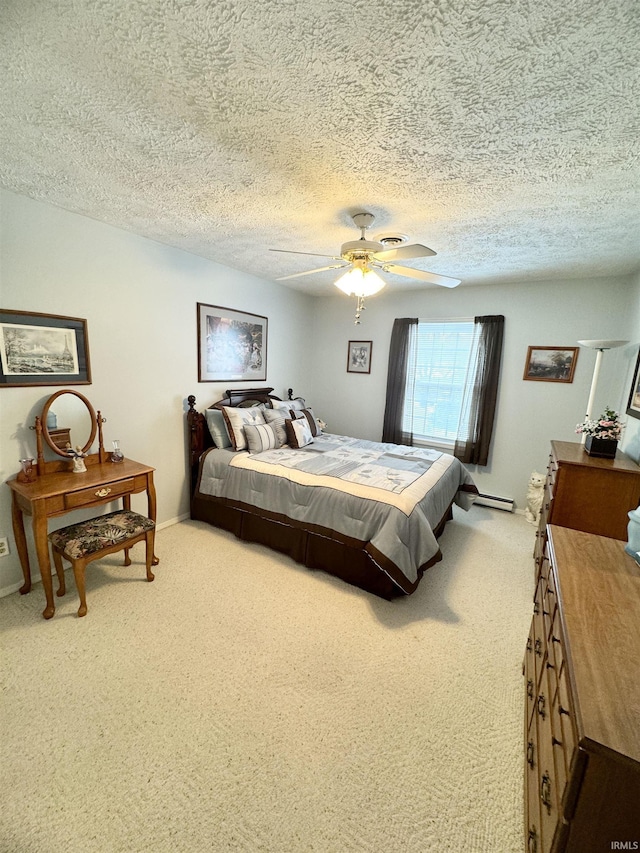 bedroom featuring a textured ceiling, ceiling fan, and carpet