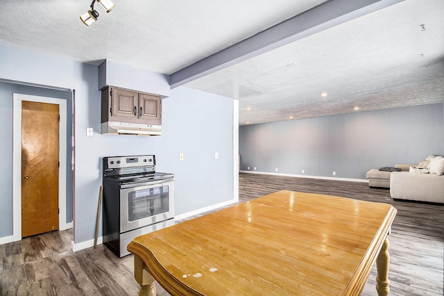 kitchen with a textured ceiling, beam ceiling, stainless steel range with electric stovetop, and hardwood / wood-style floors