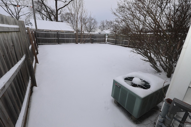 yard layered in snow with cooling unit