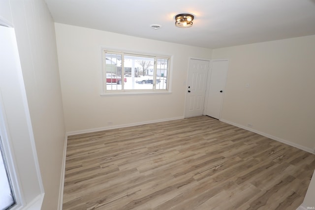 unfurnished room featuring wood-type flooring