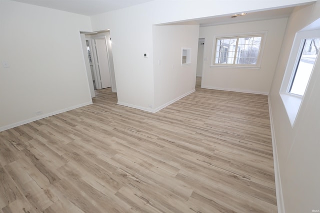 unfurnished room with light hardwood / wood-style floors