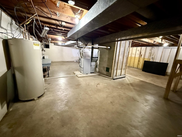 basement with water heater and heating unit