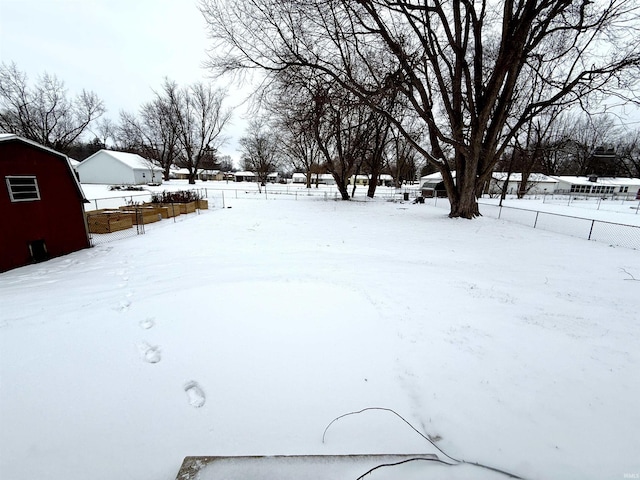 view of yard layered in snow