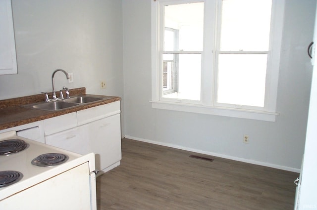 kitchen with sink, white cabinets, dark hardwood / wood-style floors, and white electric range oven