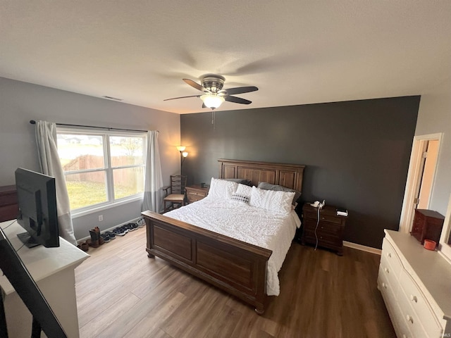 bedroom featuring ceiling fan and hardwood / wood-style floors