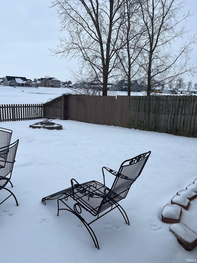 view of yard layered in snow