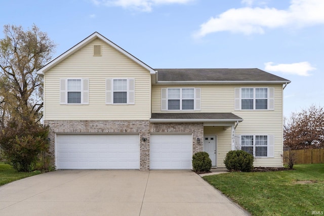 view of front of property featuring a front yard and a garage