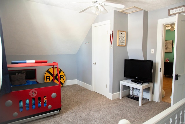 rec room featuring ceiling fan, carpet, and vaulted ceiling