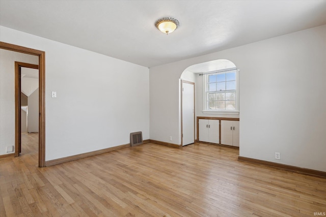 spare room with light wood-type flooring