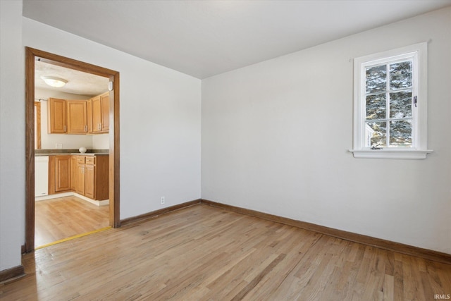 unfurnished room with light hardwood / wood-style floors