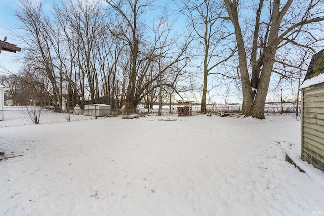 view of yard covered in snow