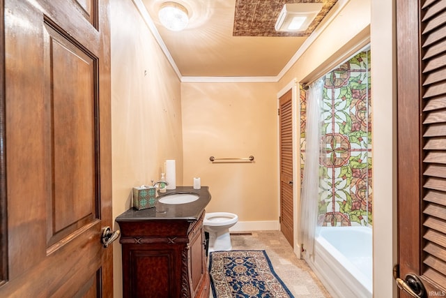 bathroom with toilet, vanity, and ornamental molding