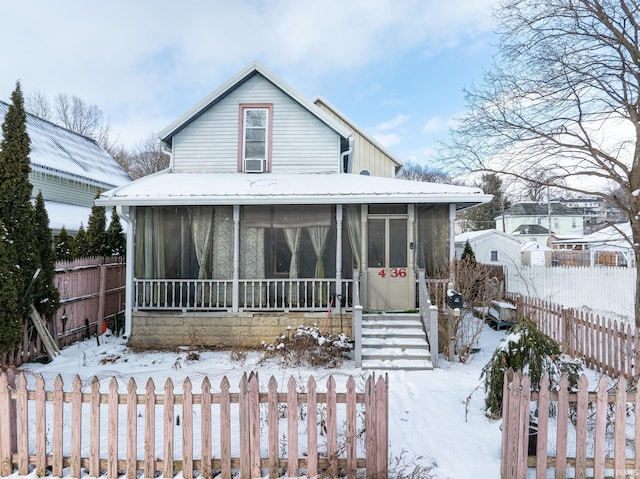 view of front of home with a sunroom