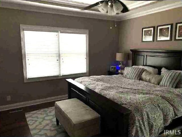 bedroom featuring crown molding and ceiling fan