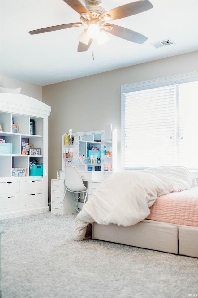 carpeted bedroom featuring ceiling fan