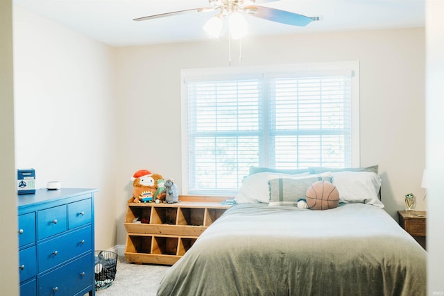 bedroom with ceiling fan and carpet