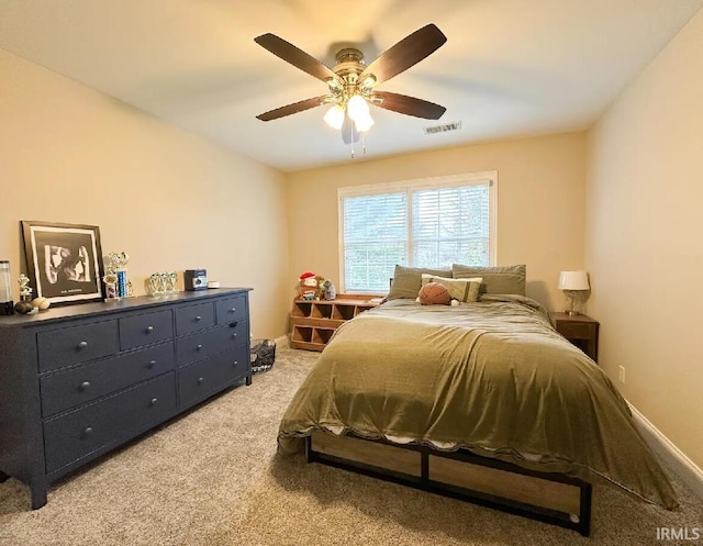 bedroom featuring ceiling fan and light colored carpet