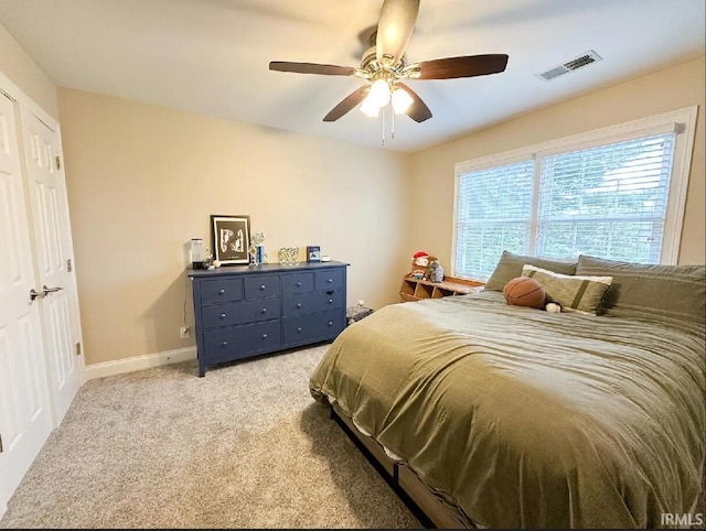 carpeted bedroom featuring ceiling fan