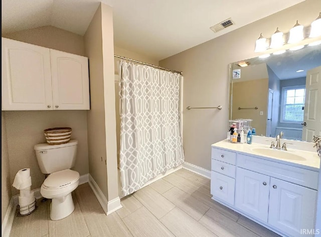 bathroom featuring vanity, lofted ceiling, toilet, and a shower with shower curtain