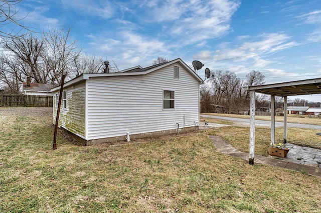 view of property exterior with a lawn