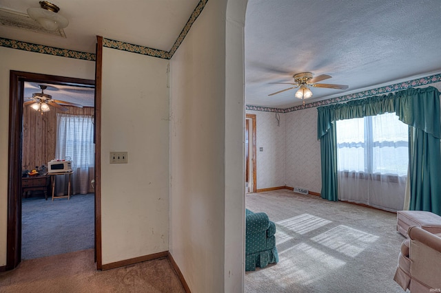 interior space with carpet flooring and a textured ceiling