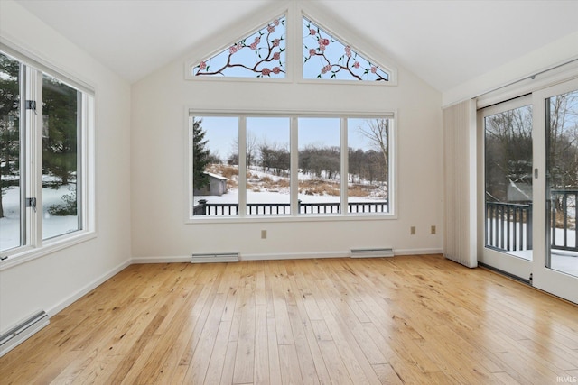 unfurnished dining area with a baseboard radiator, light hardwood / wood-style flooring, and lofted ceiling