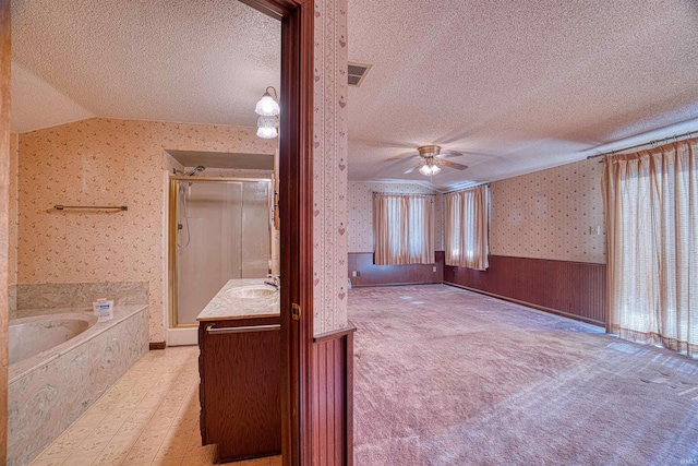 interior space with light carpet, wooden walls, ceiling fan, lofted ceiling, and sink