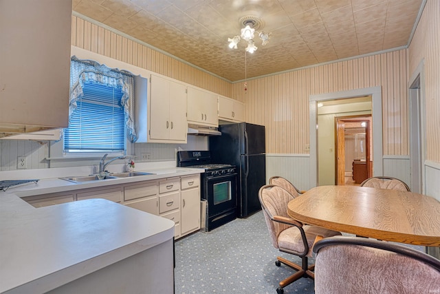 kitchen featuring black appliances, white cabinets, sink, and ornamental molding