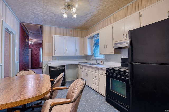 kitchen featuring black appliances, sink, white cabinetry, and ornamental molding