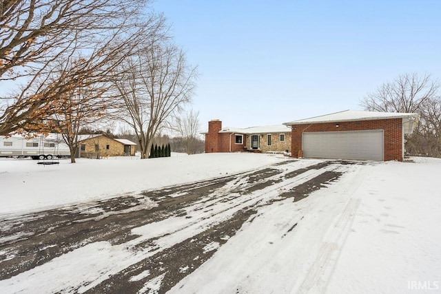 ranch-style home featuring a garage